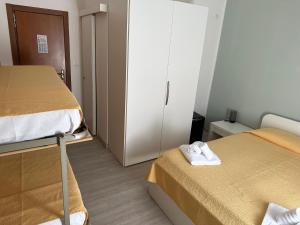 Voodi või voodid majutusasutuse Hotel La Bussola toas