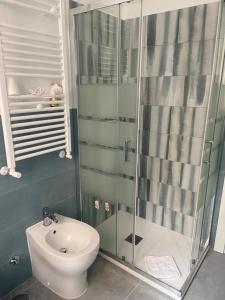a bathroom with a toilet and a glass shower at Air Vatican in Rome