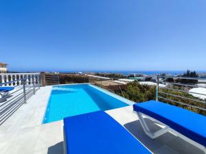 a swimming pool on the roof of a house at Villa Delicia in Torrox