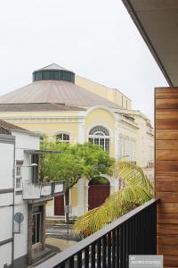 a view of a building from a balcony at Azores Essence - Coliseu in Ponta Delgada