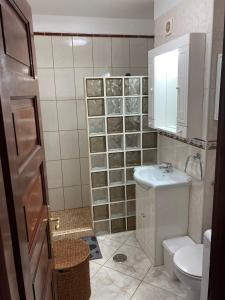 a bathroom with a toilet and a sink at Victoria Court 2, Los Cristianos in El Guincho