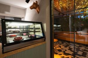 a display case in a restaurant with food in it at Wolf Suites in Antalya