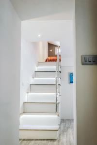 a staircase in a room with white walls at Alpha loft 1BR apartment in center in Zadar