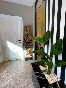 a statue of a tiger standing next to a door at Wolf Suites in Antalya