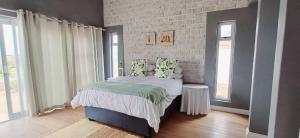 Postel nebo postele na pokoji v ubytování Sunbay