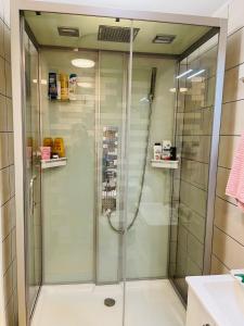 a shower with a glass door in a bathroom at Sweet dreams Porvoo in Porvoo