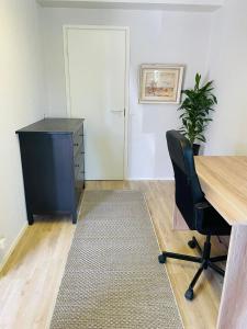 an empty office with a desk and a chair at Sweet dreams Porvoo in Porvoo