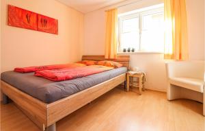 Postel nebo postele na pokoji v ubytování Ferienwohnung Mit Gartenzaun