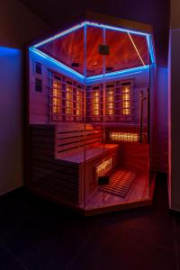 a model of a building with a blue light at Luxury Hedone Apartment near the Bridge with Private SPA Zone in Zadar
