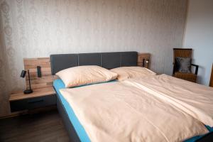 Rúm í herbergi á Urlaub für Mensch und Tier - Appartements Pirkhof