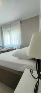 Postel nebo postele na pokoji v ubytování Villa Roso