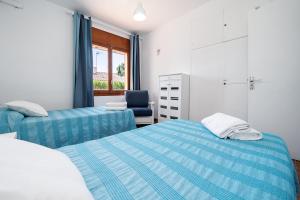 En eller flere senge i et værelse på VILLA PESCADOR