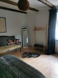 Posteľ alebo postele v izbe v ubytovaní Maison de village brocante