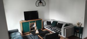 Telewizja i/lub zestaw kina domowego w obiekcie Lodge Loupau Maga