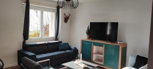 Telewizja i/lub zestaw kina domowego w obiekcie Lodge Loupau Maga