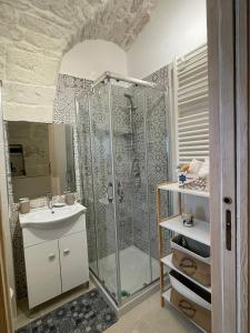 a bathroom with a shower and a sink at La quiete in Ceglie Messapica