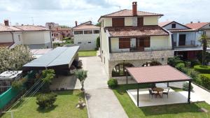 an aerial view of a house with a backyard at Apartments Krnjic in Umag