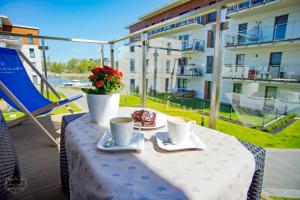Balkón alebo terasa v ubytovaní Marina Apartament 13 Iława - z prywatnym miejscem parkingowym