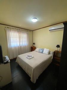 Ένα ή περισσότερα κρεβάτια σε δωμάτιο στο Carpe Diem