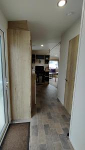 a living room with a sliding door and a living room at 3 Bedroom Mobile Home - Workers & Vans Not Allowed in Port Seton