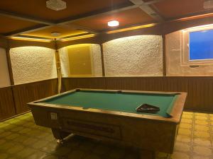 a room with a pool table in a room at Hotel-Restaurant Theis-Muehle in Biersdorf