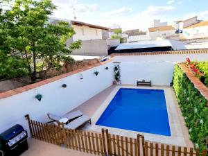 an image of a swimming pool on the roof of a house at Burbujas Manchegas in El Toboso