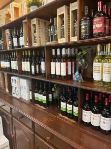 a shelf filled with lots of bottles of wine at Quinta de São Domingos house in Peso da Régua