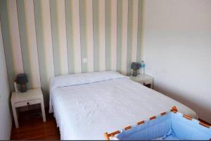 Łóżko lub łóżka w pokoju w obiekcie Bonito chalet a 2 Km de Liencres y playas.