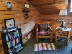 a corner of a room with a chair and a table at Hidden Bear Retreat Center in Clark Fork