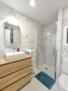 a bathroom with a shower and a sink at Fantastic apartment Sant Adria Beach in Sant Adria de Besos