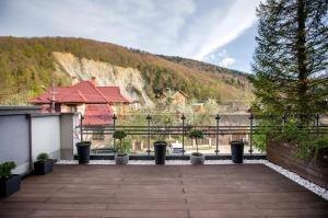 a balcony with a view of a mountain at Reef Terrace Apartments in Yaremche