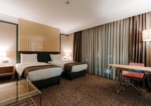 Säng eller sängar i ett rum på Invite Hotel Corner Trabzon