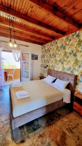 a bedroom with a large bed in a room at Anna Garden Sidari in Sidari