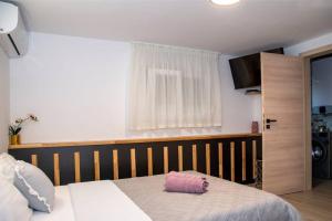 Ένα ή περισσότερα κρεβάτια σε δωμάτιο στο Shtorya - city centre apartman