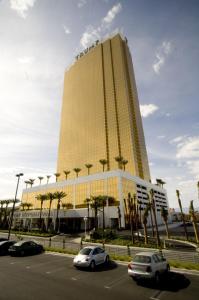 a large building with cars parked in a parking lot at Trump International Hotel Las Vegas in Las Vegas