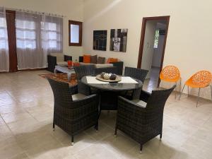 a dining room with a table and chairs at Golf And Beach Paradise in San Pedro de Macorís