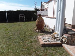 a large vase sitting next to a house at Villetta a schiera nei pressi del mare in Livorno