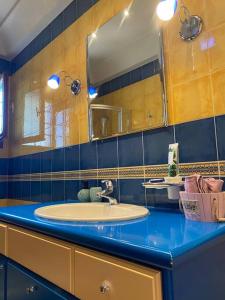 a bathroom with a sink and a mirror at La Grande Maison,Lefokastro in Afissos +62 photos
