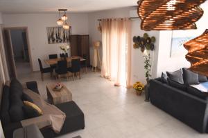 a living room with a couch and a table at Papachristos Villa in Prinos