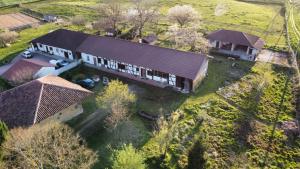 an overhead view of a large house with a roof at Longère bressane de la Verne in Cormoz +10 photos
