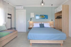 a bedroom with two beds in a room at Sandra's luxury stay in Akti Salonikiou
