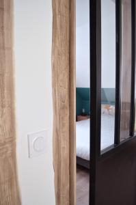 Posteľ alebo postele v izbe v ubytovaní Eco-Appart'hôtel Rouen - SLT