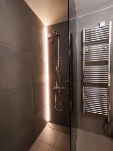 a bathroom with a shower with a glass door at Υ27 Modern Design Studio in Mytilini
