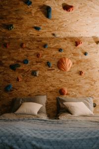 a bedroom with a rock wall with fruit on the wall at Na miły Bug Guesthouse by Bug river 