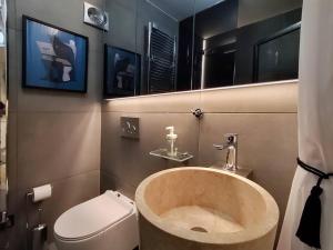 a bathroom with a sink and a toilet at Υ27 Modern Design Studio in Mytilini +12 photos