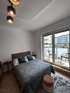 Posteľ alebo postele v izbe v ubytovaní Apartament Pileckiego
