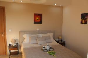 a bedroom with a large bed with two night stands at Myrina View in Myrina