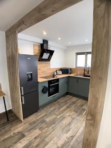 Kuchyňa alebo kuchynka v ubytovaní Eco-Appart'hôtel Rouen - SLT