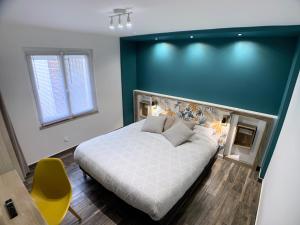 Posteľ alebo postele v izbe v ubytovaní Eco-Appart'hôtel Rouen - SLT + 30 fotografií