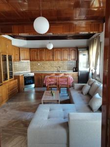 a living room with a couch and a table at Summer Life in Panayia
